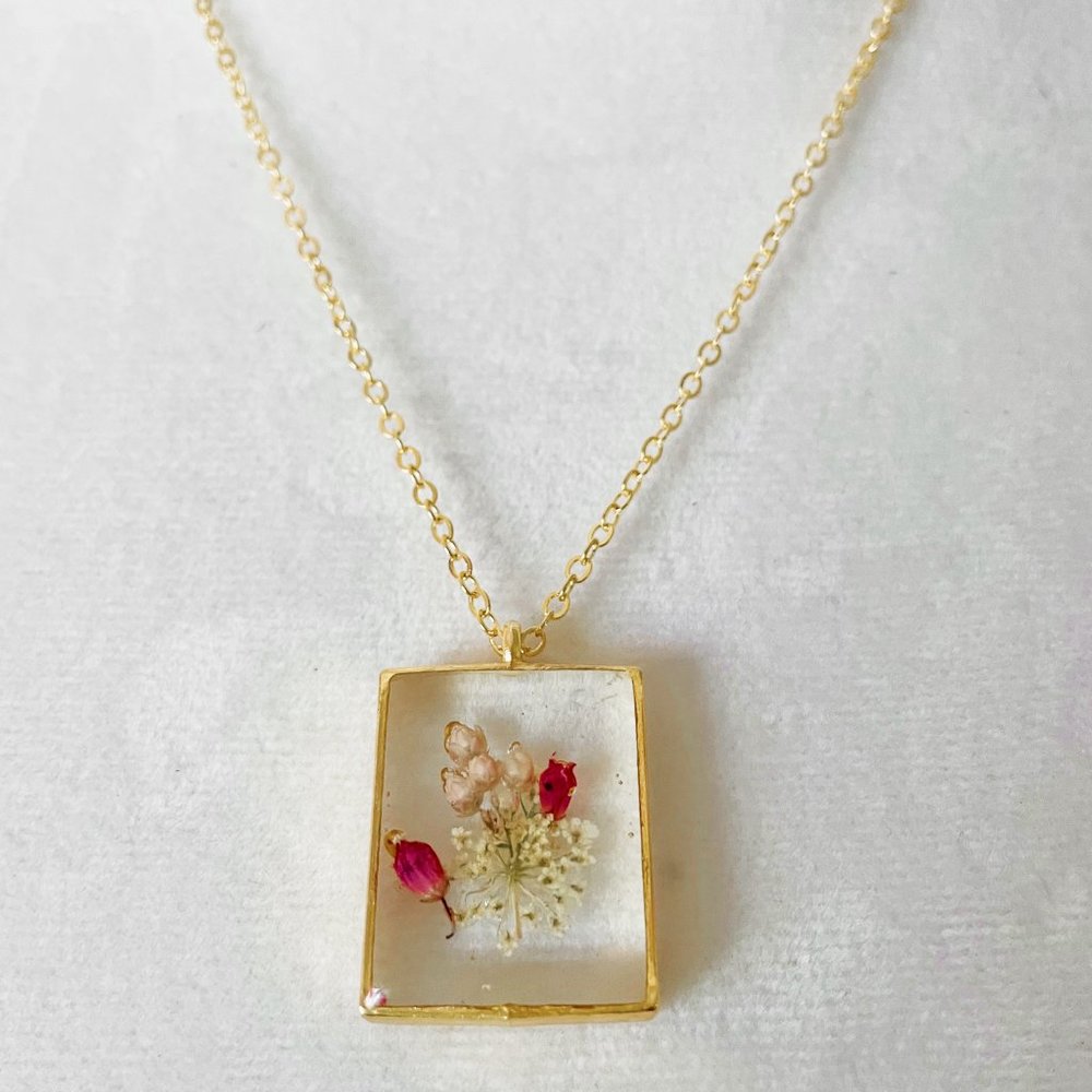 Pretty white and pink floral flower botanical resin necklace in gold bezel - Picture 2 of 3